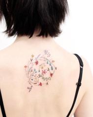Delicate-Botanical-Back-Tattoo.jpg